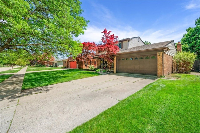 15672 Robert Dr, Macomb, MI 48044 - view of front facade featuring a garage, a front yard, brick siding, concrete driveway, and a chimney