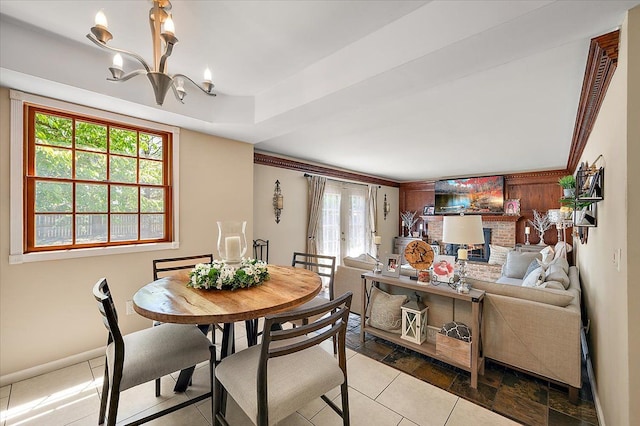 15672 Robert Dr, Macomb, MI 48044 - dining space featuring a chandelier, baseboards, and tile patterned floors