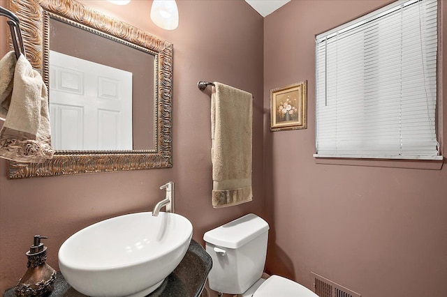 15672 Robert Dr, Macomb, MI 48044 - bathroom featuring toilet and a sink