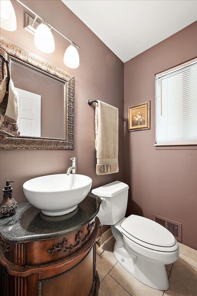 15672 Robert Dr, Macomb, MI 48044 - bathroom with tile patterned flooring, toilet, and vanity