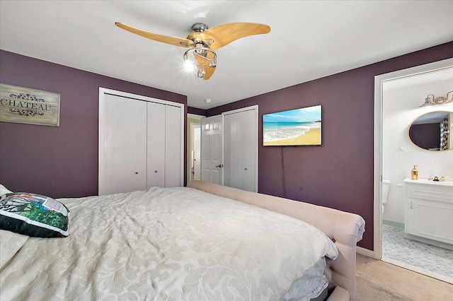 15672 Robert Dr, Macomb, MI 48044 - bedroom featuring light colored carpet, ensuite bath, a ceiling fan, and baseboards