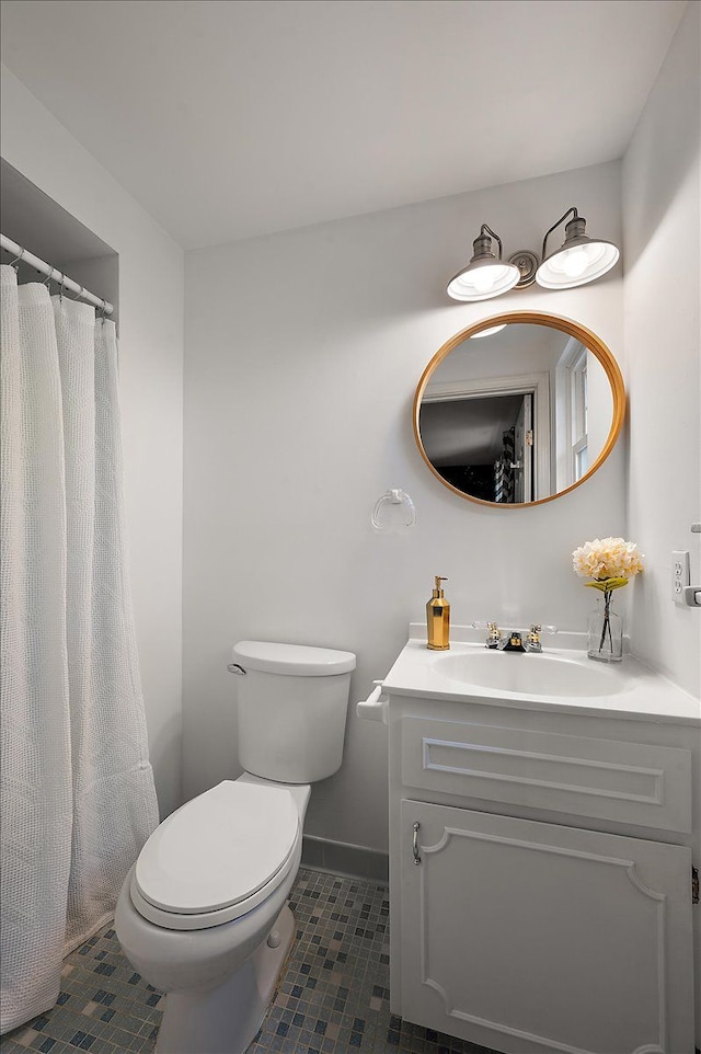 15672 Robert Dr, Macomb, MI 48044 - bathroom with tile patterned flooring, toilet, vanity, and baseboards