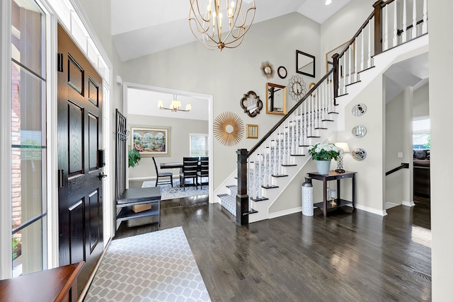 entryway featuring a chandelier, stairs, dark wood-style floors, high vaulted ceiling, and baseboards