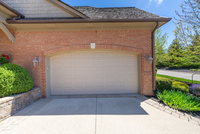garage with concrete driveway