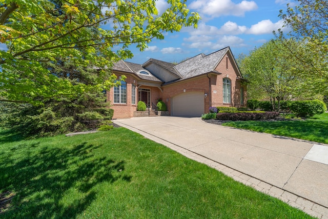 view of front of home featuring brick siding, an attached garage, concrete driveway, and a front lawn