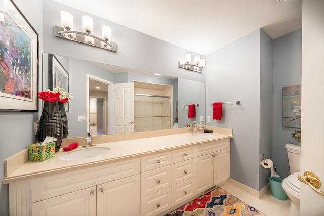full bathroom with toilet, a stall shower, tile patterned floors, double vanity, and baseboards