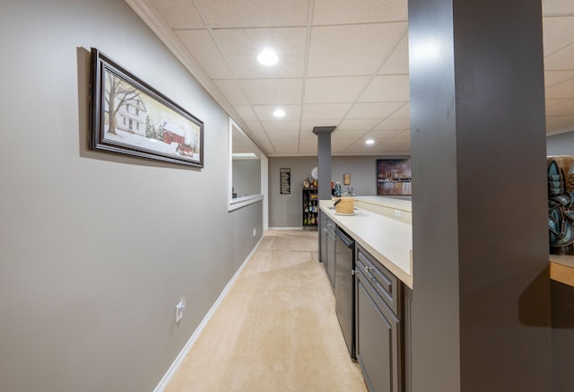 indoor dry bar featuring a drop ceiling, recessed lighting, light carpet, baseboards, and dishwasher