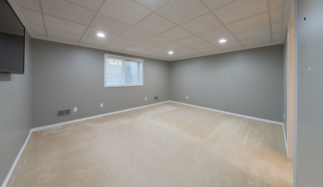 basement featuring carpet, baseboards, recessed lighting, and a paneled ceiling