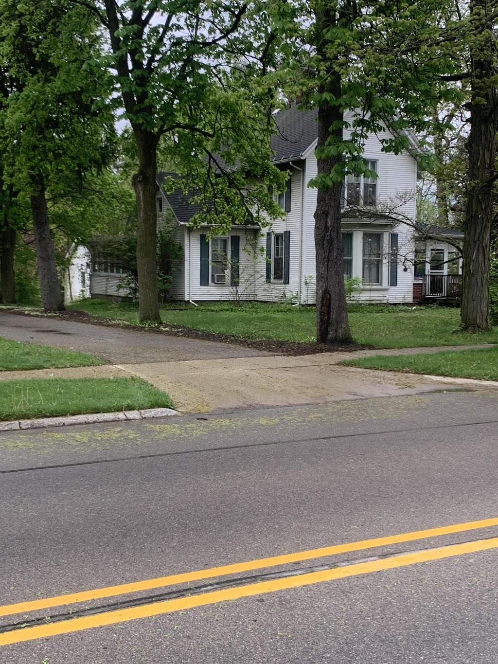 304 E Henry St Unit 18, Saline, MI 48176 - view of front of home with a front yard and brick siding
