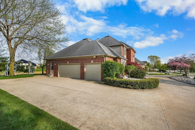 47352 Dove Ct, Shelby Twp, MI 48315 - view of side of property featuring brick siding, an attached garage, driveway, and roof with shingles