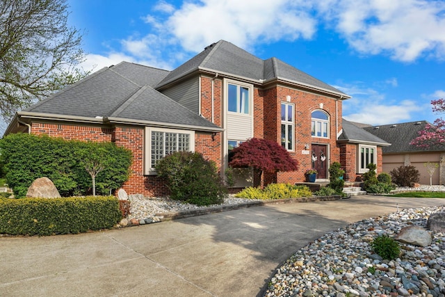 47352 Dove Ct, Shelby Twp, MI 48315 - view of front of house featuring brick siding and a shingled roof