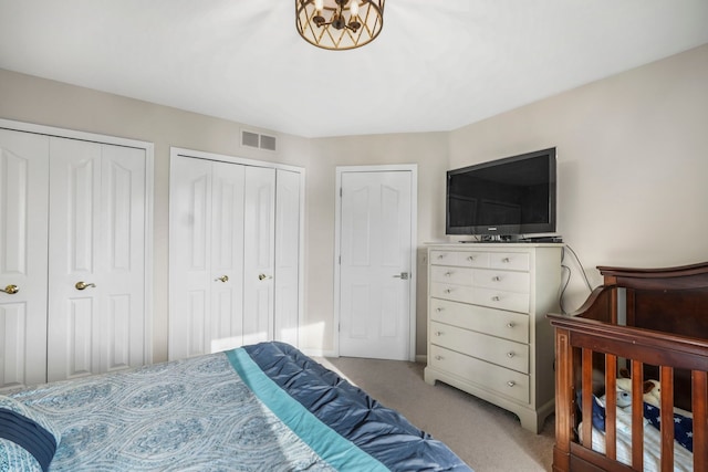 47352 Dove Ct, Shelby Twp, MI 48315 - carpeted bedroom featuring two closets