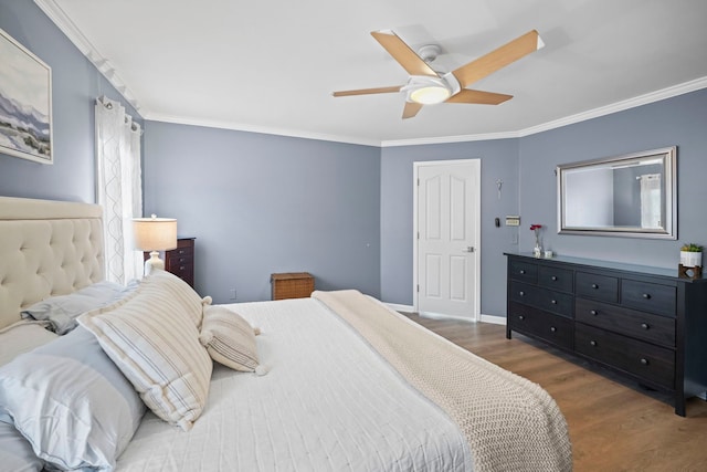 47352 Dove Ct, Shelby Twp, MI 48315 - bedroom with wood finished floors, crown molding, a ceiling fan, and baseboards