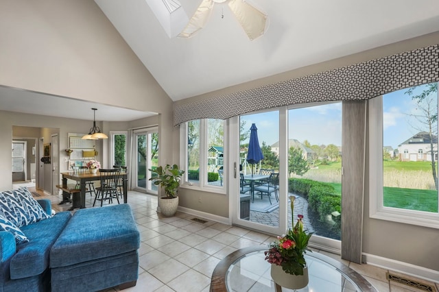 47352 Dove Ct, Shelby Twp, MI 48315 - sunroom featuring baseboards, tile patterned flooring, and high vaulted ceiling