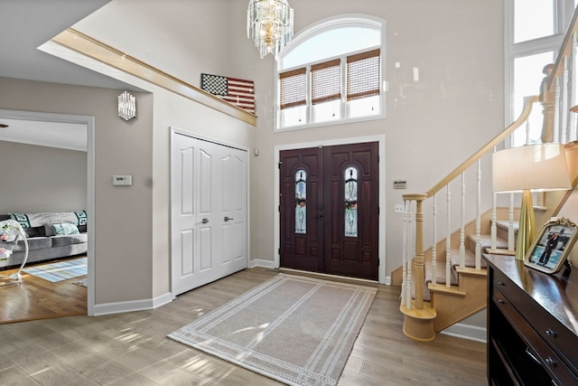 47352 Dove Ct, Shelby Twp, MI 48315 - foyer with stairway, a high ceiling, wood finished floors, baseboards, and a chandelier