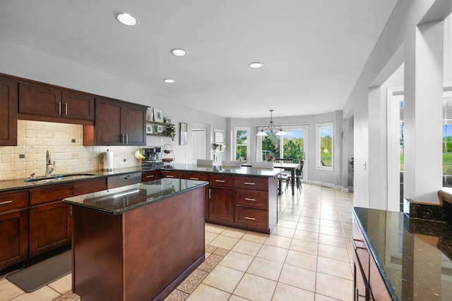 47352 Dove Ct, Shelby Twp, MI 48315 - kitchen with a sink, a peninsula, open shelves, light tile patterned floors, and recessed lighting