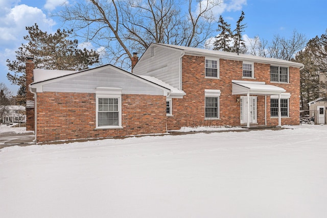 4819 Thorntree Dr, West Bloomfield, MI 48322 - view of front of property with a chimney and brick siding