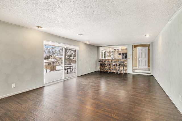 4819 Thorntree Dr, West Bloomfield, MI 48322 - unfurnished living room featuring wood finished floors, a textured ceiling, and baseboards