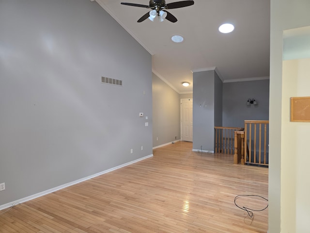 spare room with crown molding, ceiling fan, light wood-style flooring, baseboards, and recessed lighting