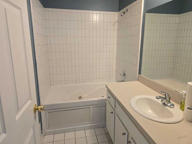 bathroom featuring tile patterned flooring, a combined bath / shower with jetted tub, and vanity