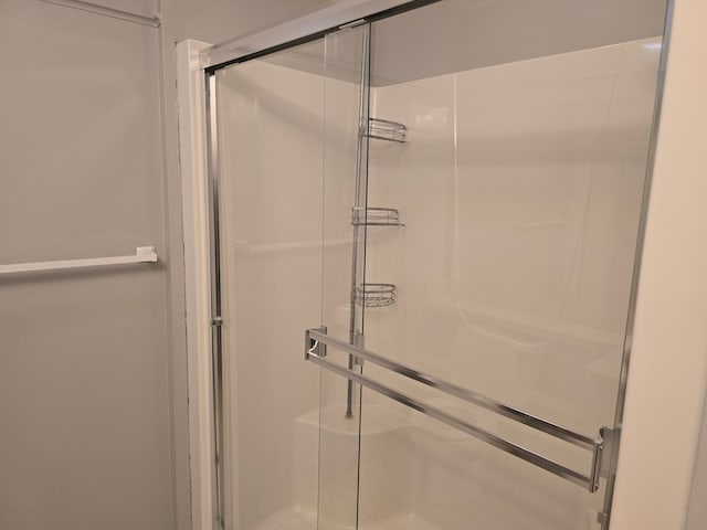 full bathroom with a shower stall