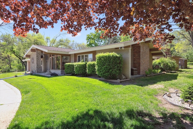 7317 Bircklan Dr, Canton, MI 48187 - back of property with brick siding and a yard