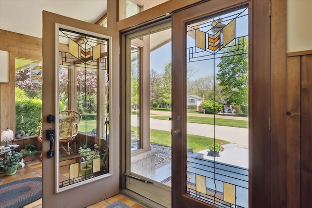 7317 Bircklan Dr, Canton, MI 48187 - doorway to outside with tile patterned floors and wooden walls