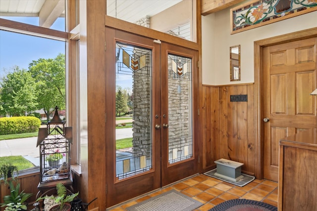 7317 Bircklan Dr, Canton, MI 48187 - entryway with wainscoting, tile patterned flooring, french doors, and wooden walls