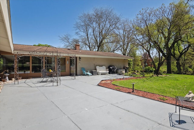 7317 Bircklan Dr, Canton, MI 48187 - rear view of house featuring a patio area, a chimney, a yard, and brick siding