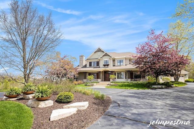 craftsman-style house with a chimney