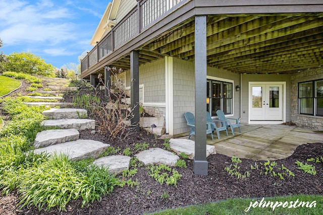 view of patio / terrace featuring french doors and a deck