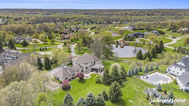 view of property location with nearby suburban area and a nearby body of water