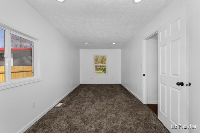 311 W Fenwick Rd, Fenwick, MI 48834 - carpeted empty room featuring a textured ceiling, baseboards, and recessed lighting