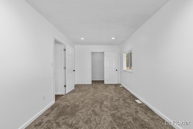 311 W Fenwick Rd, Fenwick, MI 48834 - unfurnished bedroom featuring carpet, baseboards, recessed lighting, and a closet