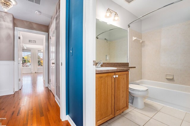 141 Paton Way, Romeo, MI 48065 - full bath with vanity, shower / bathtub combination, toilet, and hardwood / wood-style floors
