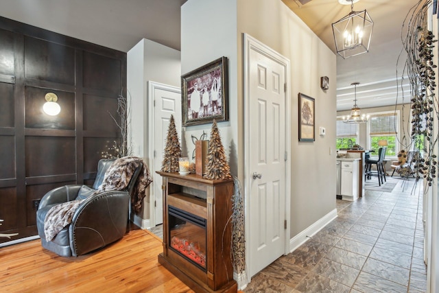 141 Paton Way, Romeo, MI 48065 - corridor featuring a chandelier and baseboards