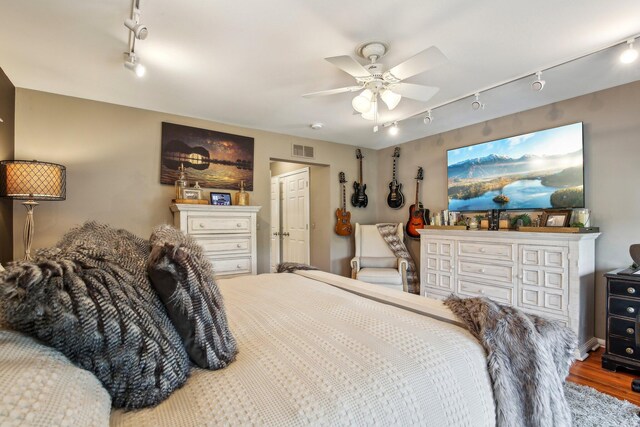 141 Paton Way, Romeo, MI 48065 - bedroom featuring track lighting, wood finished floors, and ceiling fan