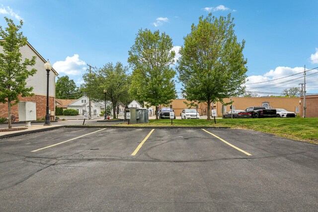 141 Paton Way, Romeo, MI 48065 - uncovered parking lot with a residential view