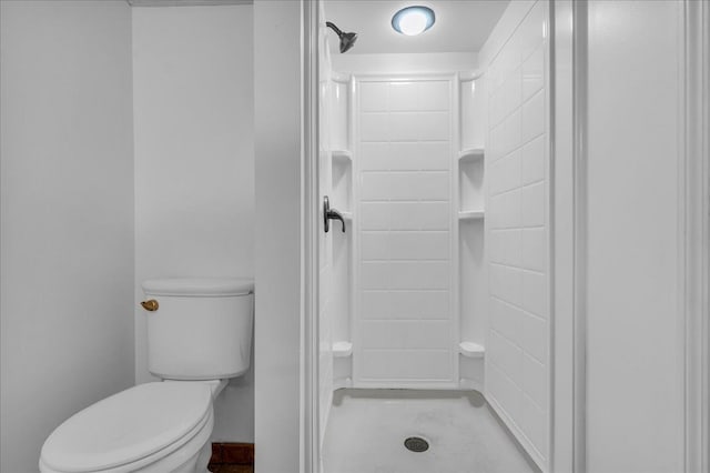 full bath featuring a stall shower and toilet