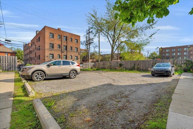 uncovered parking lot with fence