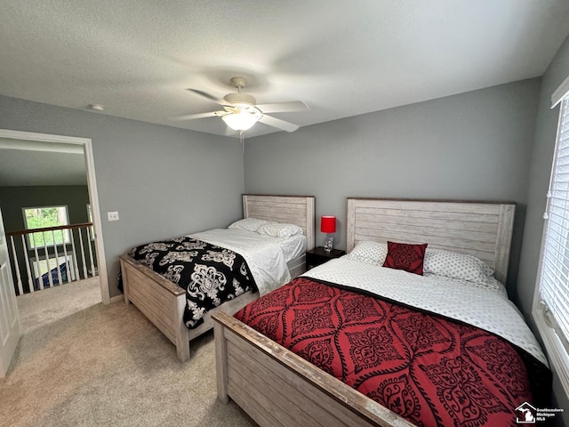 carpeted bedroom with a ceiling fan