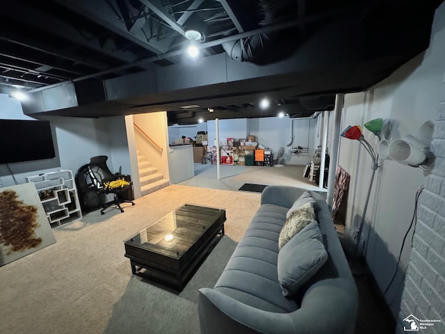 finished below grade area featuring carpet flooring and stairs