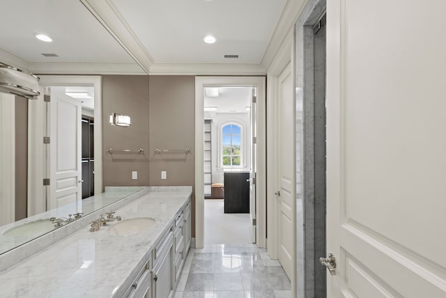 full bathroom featuring vanity, ornamental molding, recessed lighting, and marble finish floors