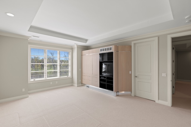 unfurnished bedroom with a raised ceiling, light carpet, baseboards, and recessed lighting