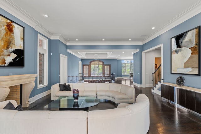 living room with wood finished floors, baseboards, crown molding, recessed lighting, and stairway