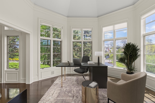 home office with healthy amount of natural light, wood finished floors, and lofted ceiling