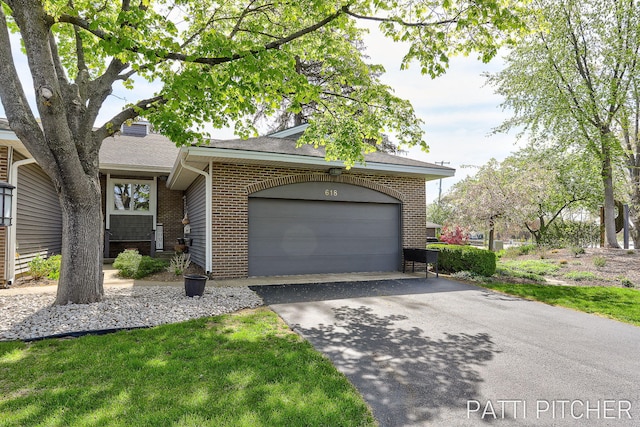 618 Edgewater Dr, Spring Lake, MI 49456 - view of front of property featuring driveway, brick siding, an attached garage, and roof with shingles