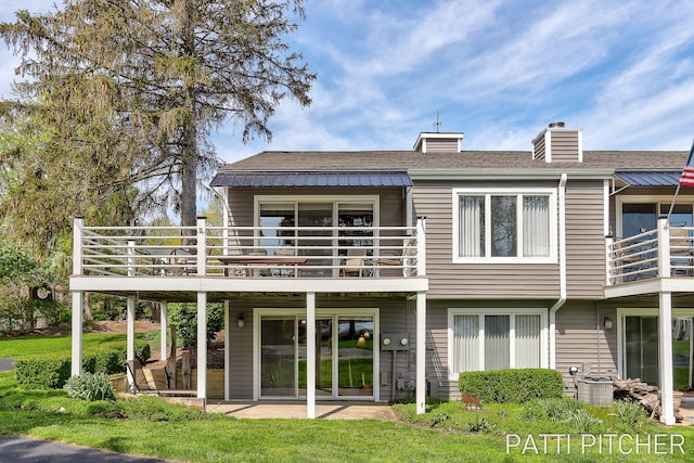618 Edgewater Dr, Spring Lake, MI 49456 - rear view of property featuring a balcony, a chimney, a patio, and roof with shingles