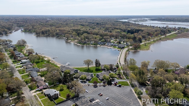 618 Edgewater Dr, Spring Lake, MI 49456 - aerial view of a nearby body of water and a heavily wooded area