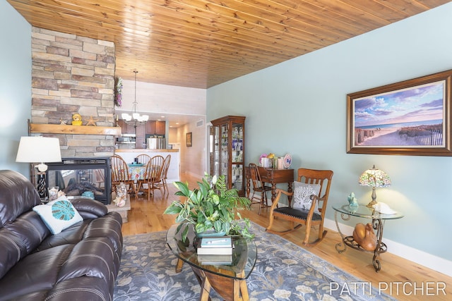 618 Edgewater Dr, Spring Lake, MI 49456 - living area featuring baseboards, wooden ceiling, a chandelier, wood finished floors, and a fireplace